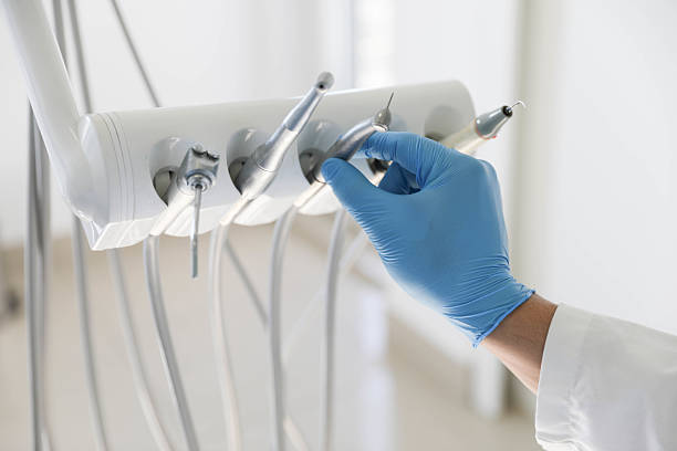 Professional Tooth Extraction technician working in Key Center, WA